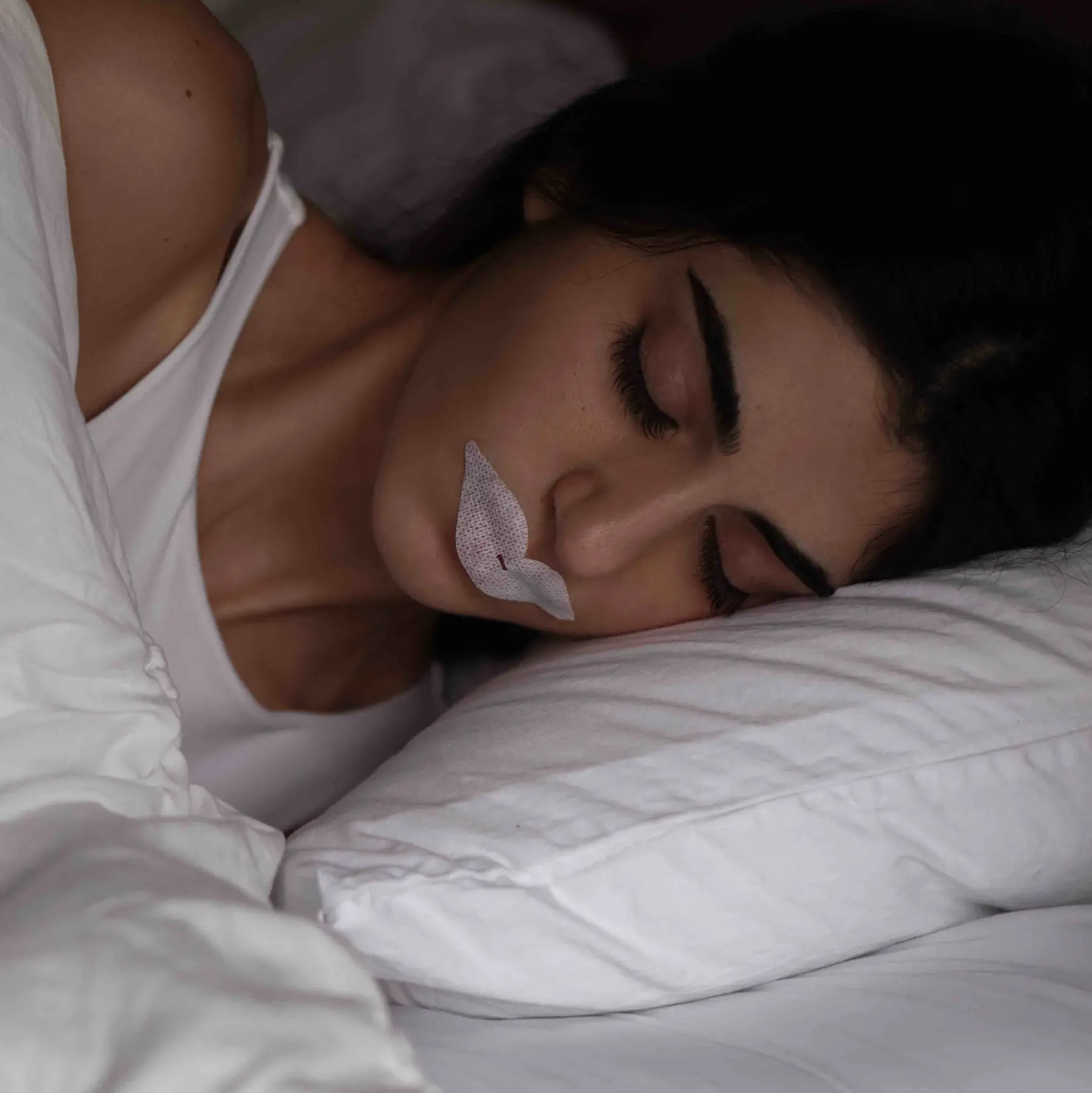 Woman using Dryft mouth tape
